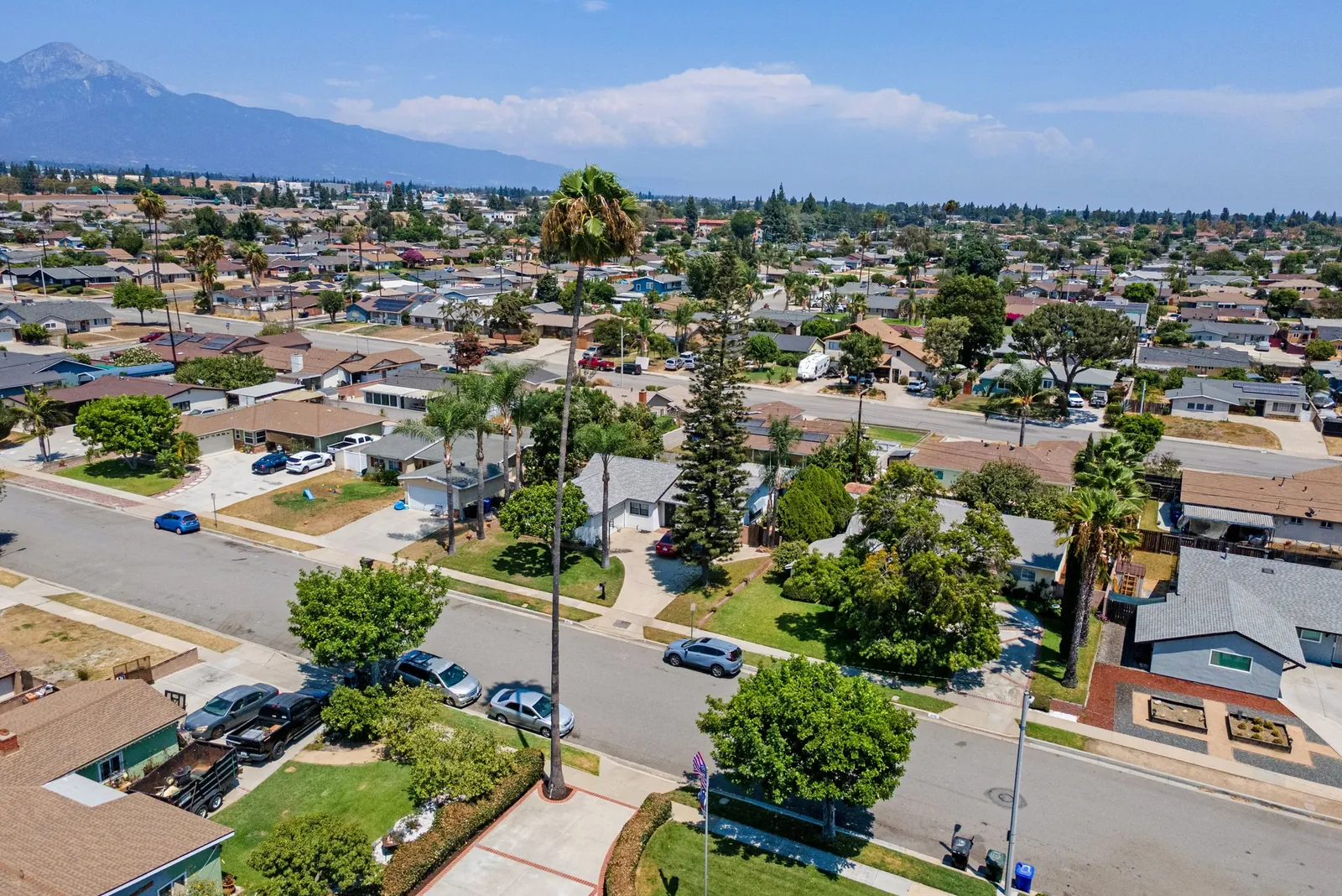Aerial view across a Montclair neighborhood toward the San Gabriel Mountains