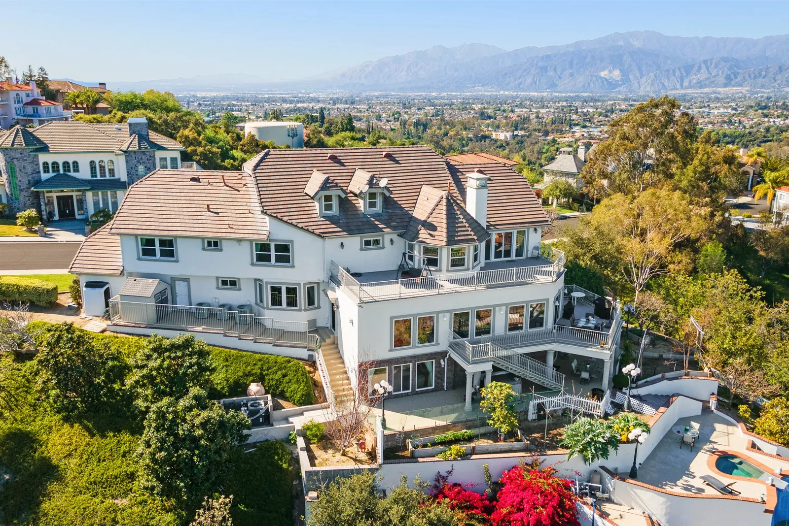 Aerial view of hillside homes in San Dimas with the San Gabriel Mountains behind